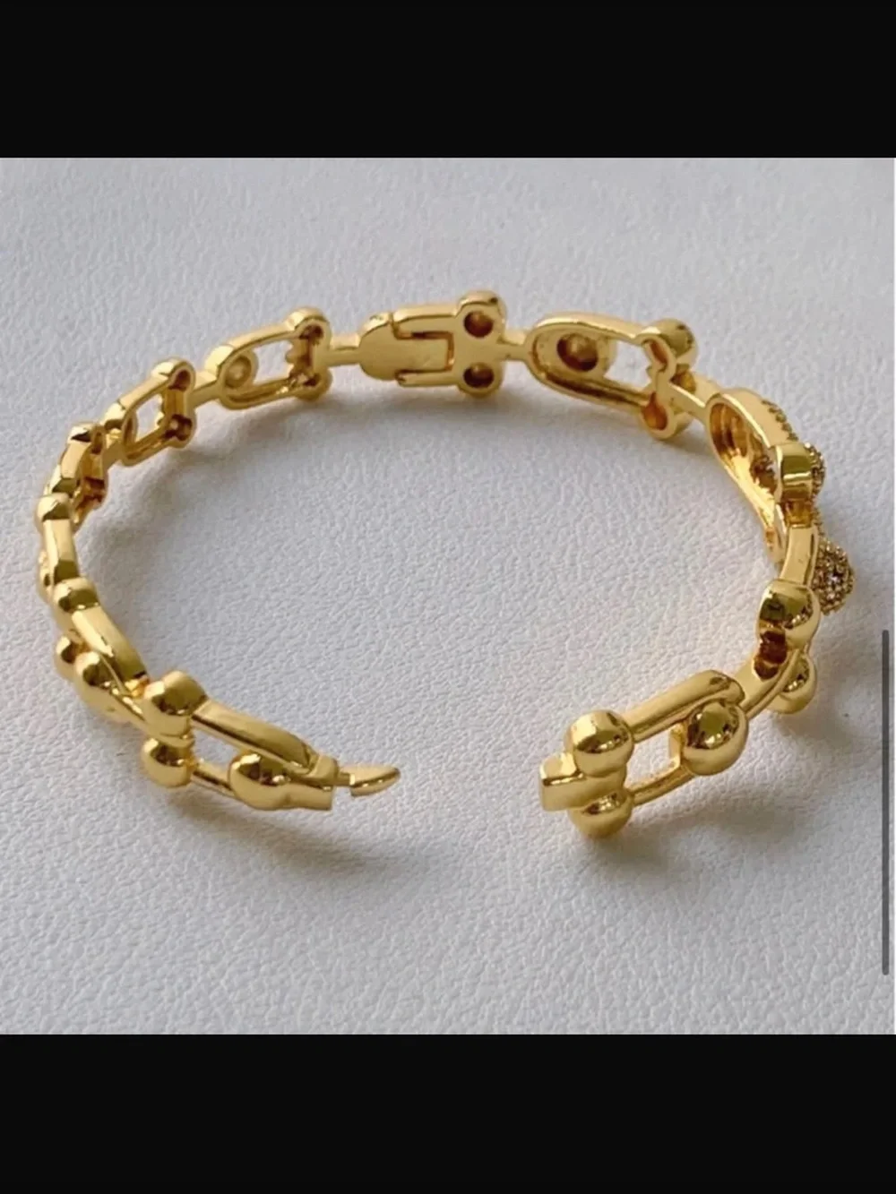 Goldtone bracelet.